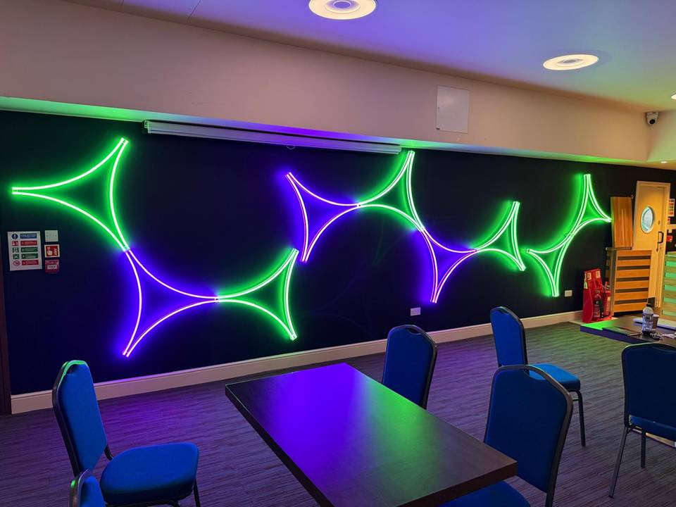 Towngate Theatre: Feature light wall in green and purple